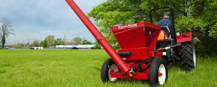 Farm King Roller Mill behind tractor
